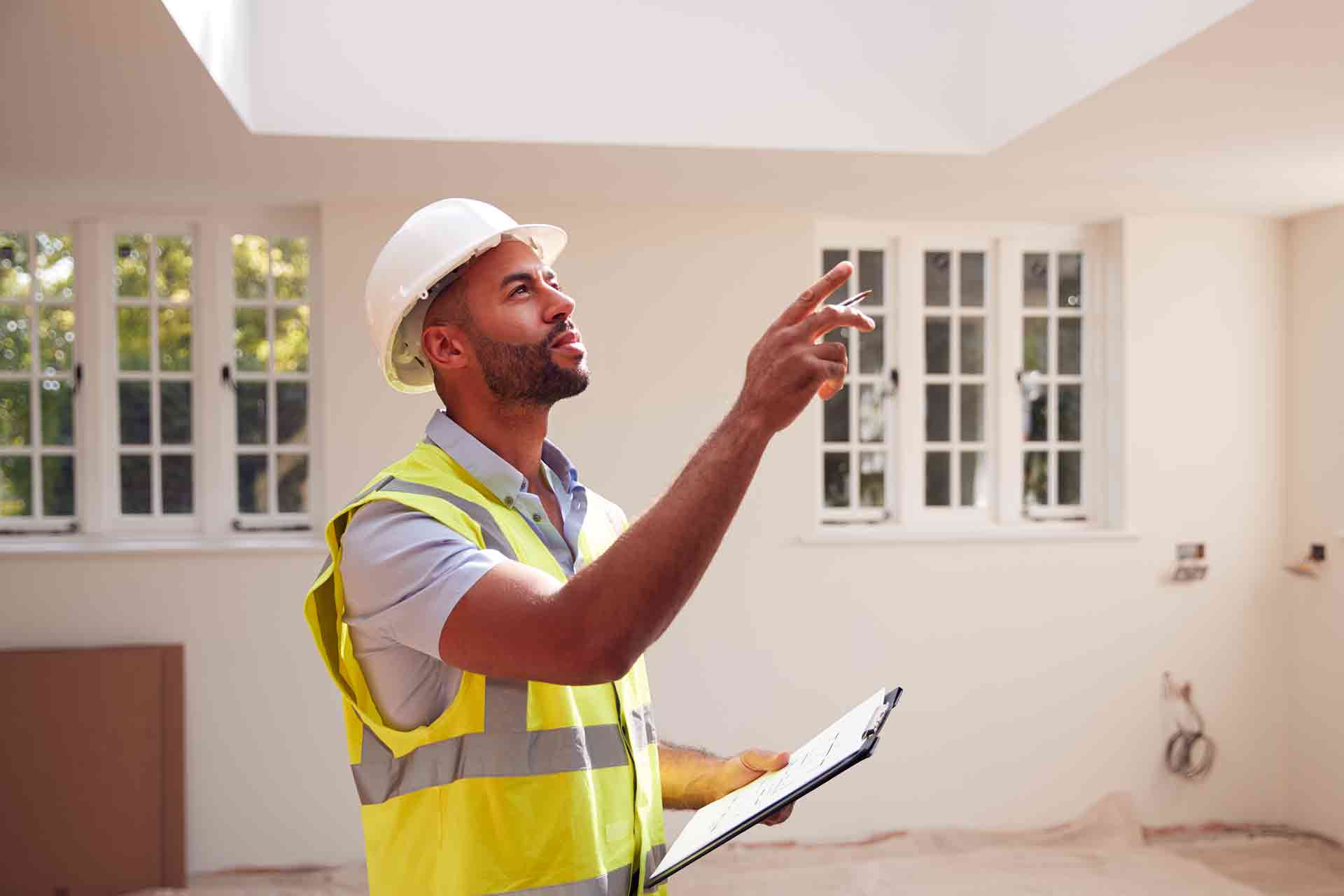 Third Party Wall Surveyors Southend on Sea reviewing plans between two parties during a dispute